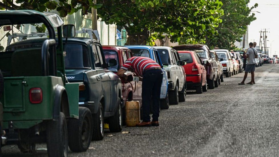 Drivers queue to get fuel near a gas station in Havana on 24 April 2023