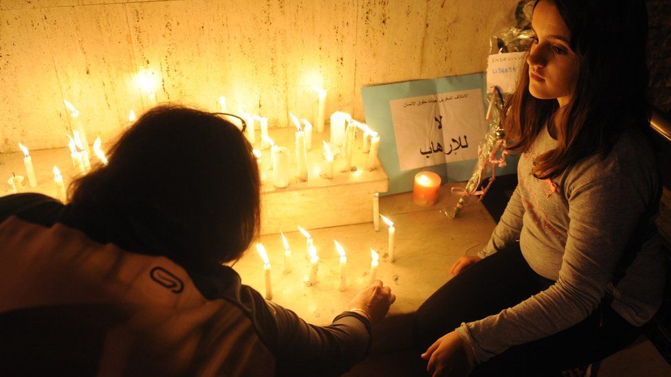 People lighting candles in Rabat, Morocco - Sunday 15 November 2015