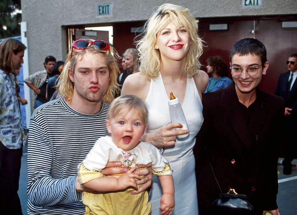 Kurt Cobain of Nirvana with wife Courtney Love and daughter Frances Bean Cobain, and Sinead O'Connor at the Universal Ampitheater in Universal City, California, US, at the Annual MTV Video Music Awards on 2 September 1993