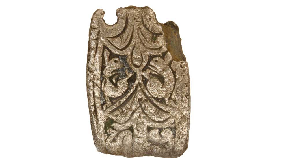 Early medieval silver strap end