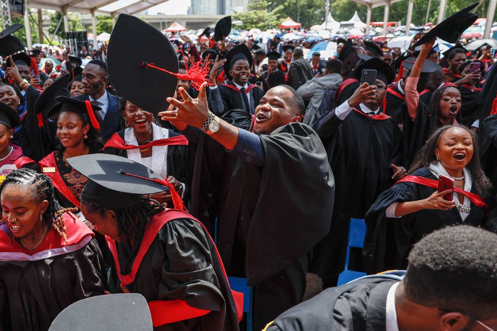 Graduates celebrate while attending a graduation ceremony at the University of Nairobi on December 15, 2023.