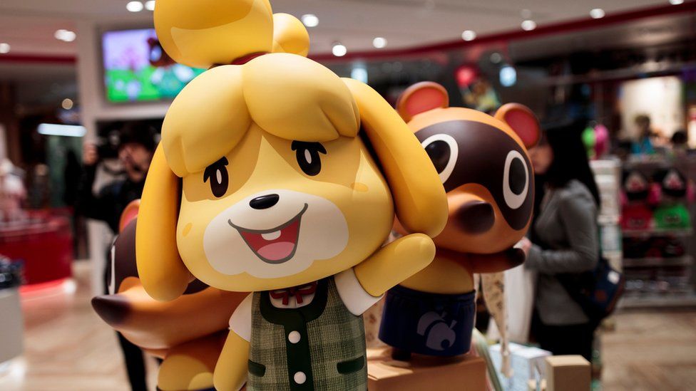 Promotional shop displays show figures of some of Animal Crossing's main characters