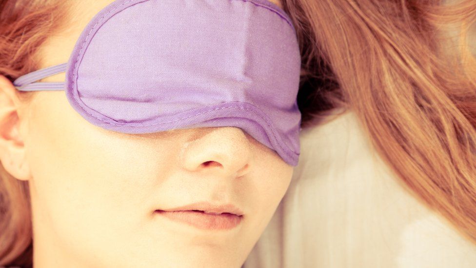 Woman in a sleeping mask