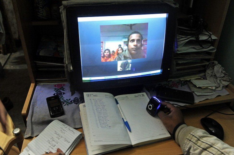 Gurukul Trust, Santosh Kumar (R), conducting an online class from New Delhi for students in a remote village in Bihar to bring education to the Indian village. Once a week, Kumar uses the Skype computer programme to teach maths to children in Chamanpura, a poor village in the struggling state of Bihar, 600 miles (970 kilometres)