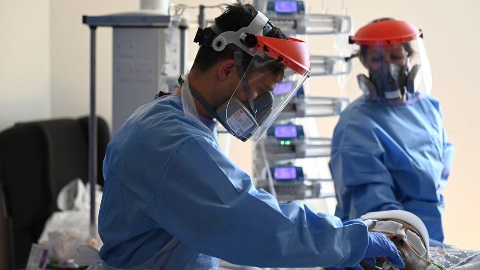 Two surgeons in PPE