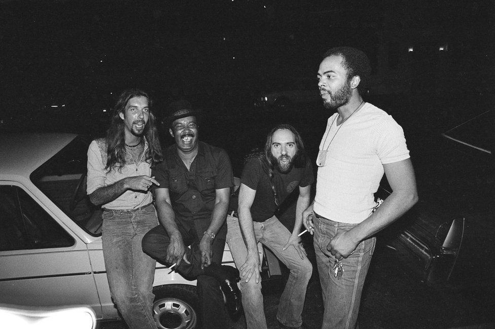 Hip Linkchain and his band relax between sets one hot August evening outside B.L.U.E.S, in 1982