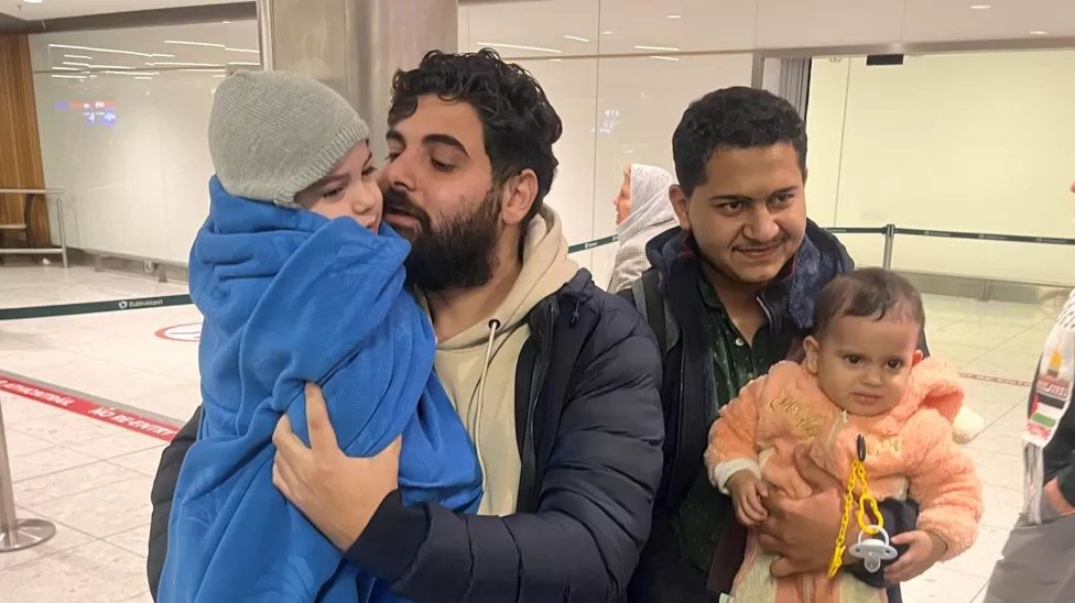 Khalid El-Estal, his four year old son Ali and one year old daughter Sara in Dublin Airport with their uncle Mohammed Jendia