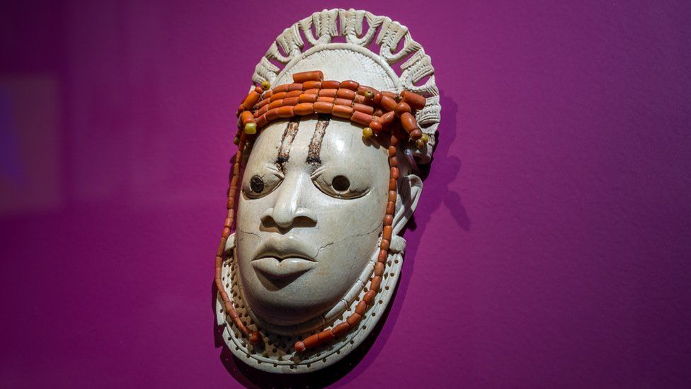 A 19th-century ivory, ceremonial hip mask in honour of Queen Mother Idia and looted by British soldiers from the Kingdom of Benin in 1897 hangs on display in the "Where Is Africa" exhibition at the Linden Museum on May 05, 2021 in Stuttgart, Germany.