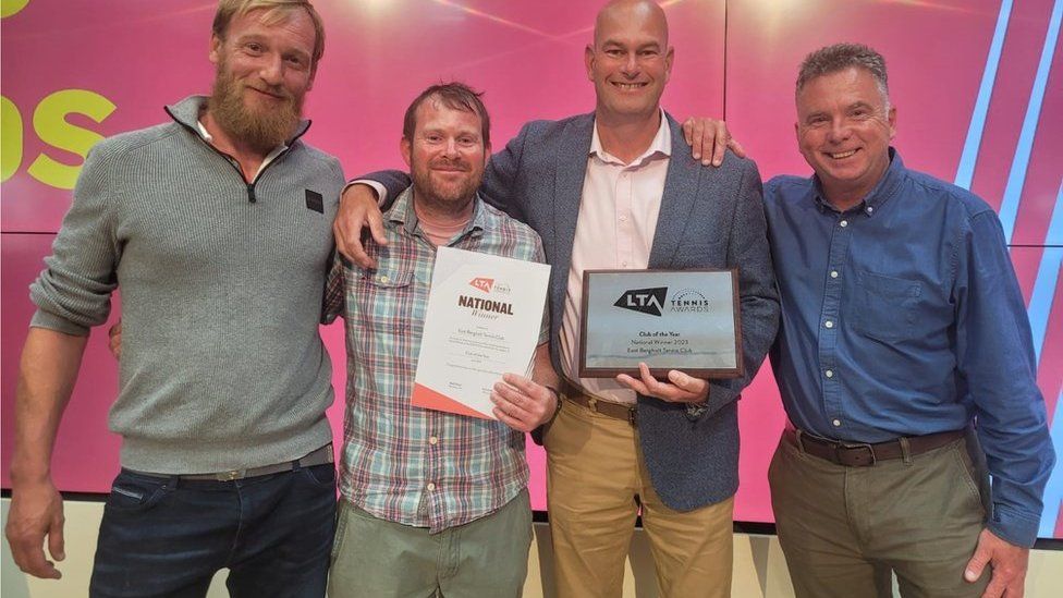 From left to right, member Richard Baldwin, chairman Paul Cansdale, head coach Matt Watson and member Paul Anderson holding the award won by East Bergholt Tennis Club