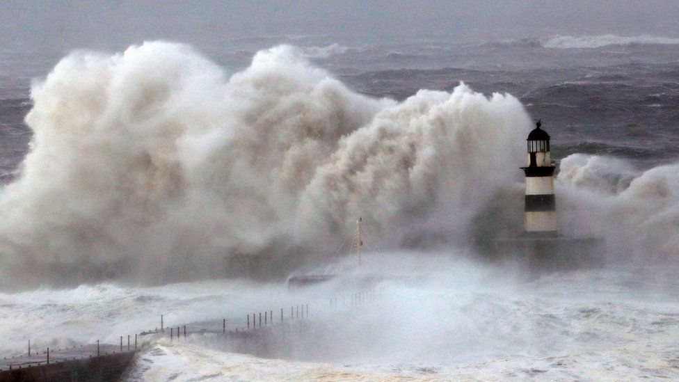 Huge waves crash against the pier wall at Seaham Lighthouse during Storm Arwen, in Seaham, County Durham on 27 November