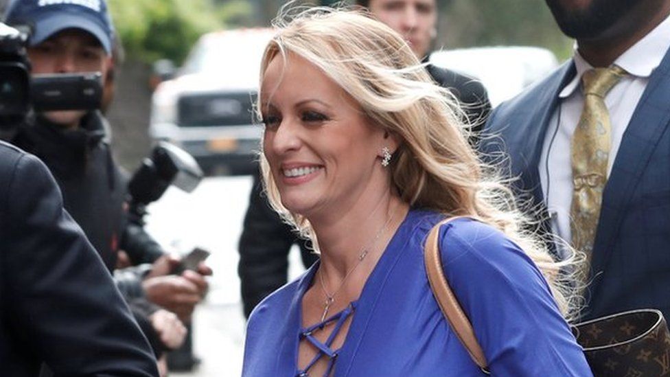 Adult-film actress Stephanie Clifford, also known as Stormy Daniels, arrives with her attorney Michael Avenatti (L) at ABC studios to appear on The View talk show in New York City