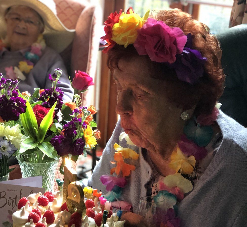 Iola Roberts blowing out her 87th birthday candles