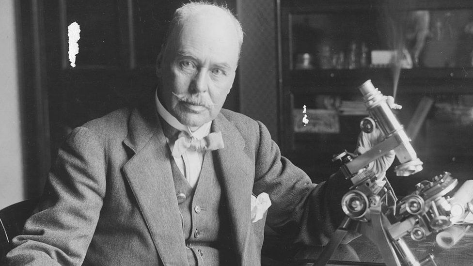 Portrait of Sir Ronald Ross, winner of the Nobel Prize for Medicine in 1902, sitting at a microscope in his laboratory, February 1927