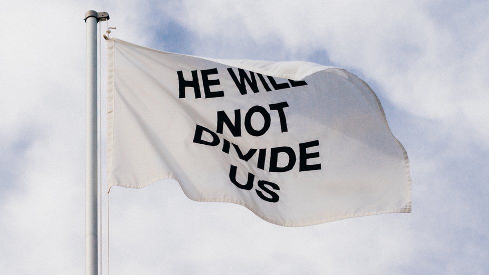 He will not divide us flag