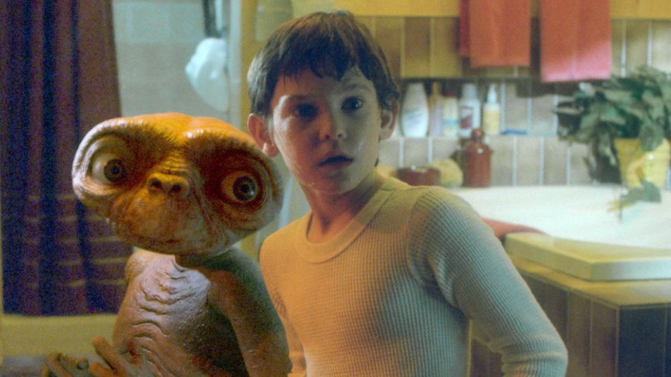 An image of Elliott and the alien E.T.