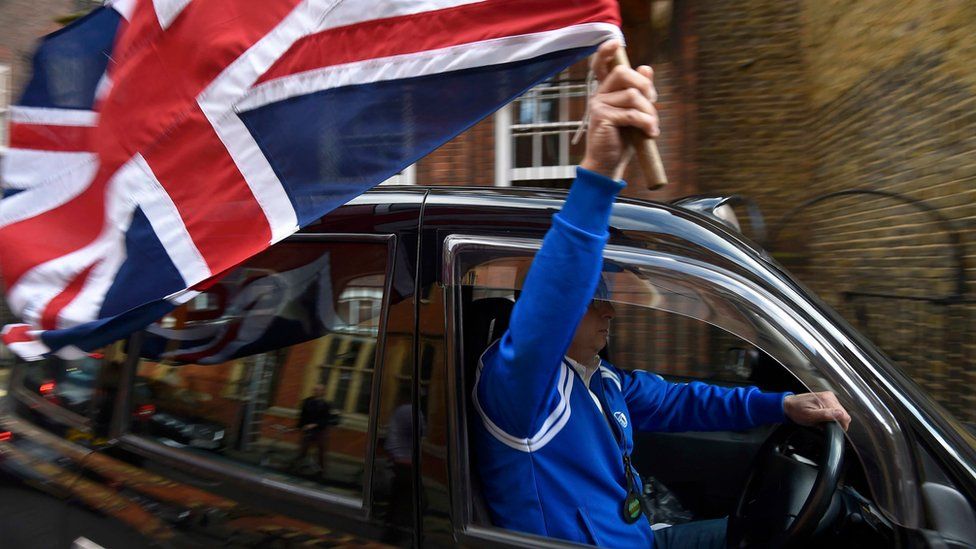 Taxi driver waves Union Flag