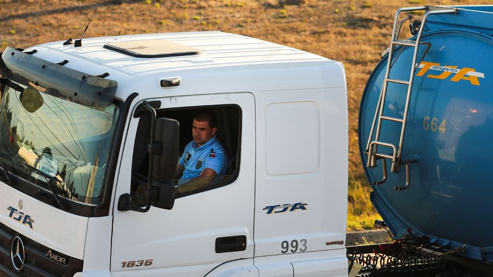 Policeman driving tanker truck, 12 Aug 19