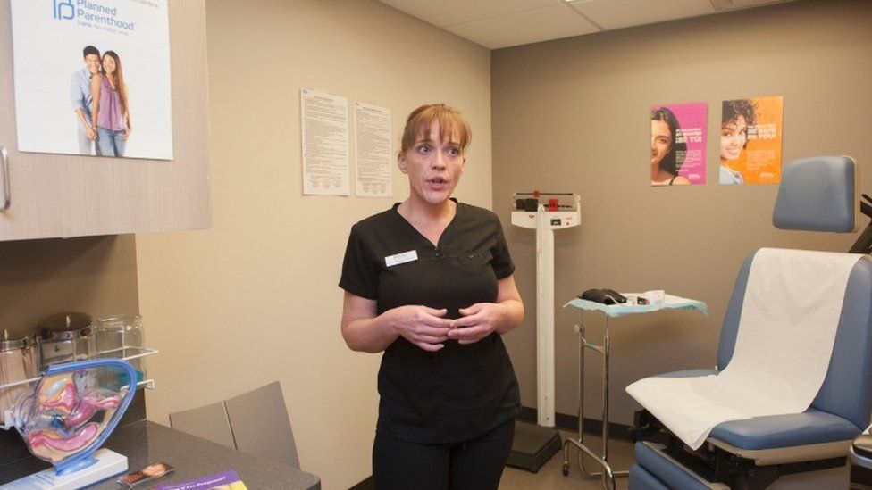 A clinician at a Planned Parenthood in Arizona shows one of the patient exam room