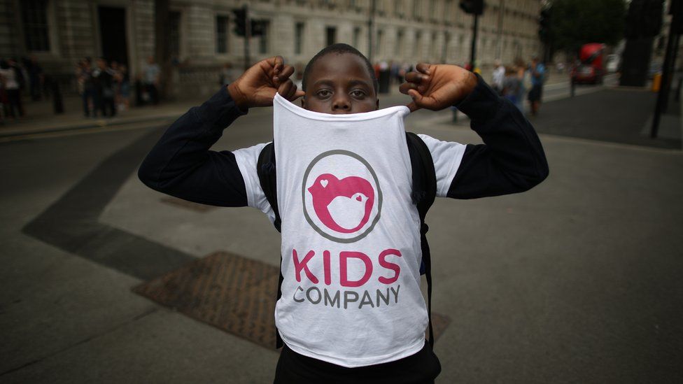 A young protestor on Whitehall in the week of the charity's closure