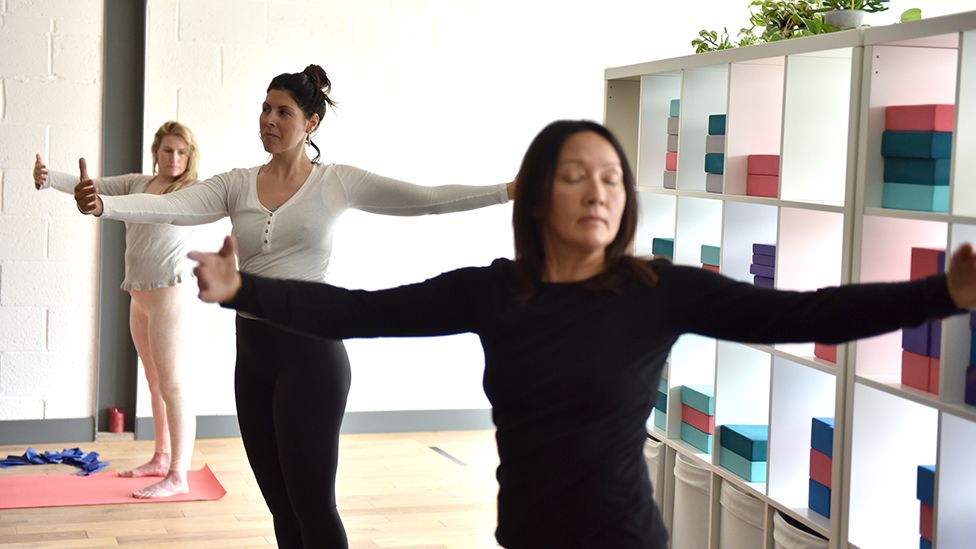 A group of women take part in an indoors yoga class at Anahata, heart centred and nurturing Wellbeing Studio on May 17, 2021 in Leigh -on-Sea, England.