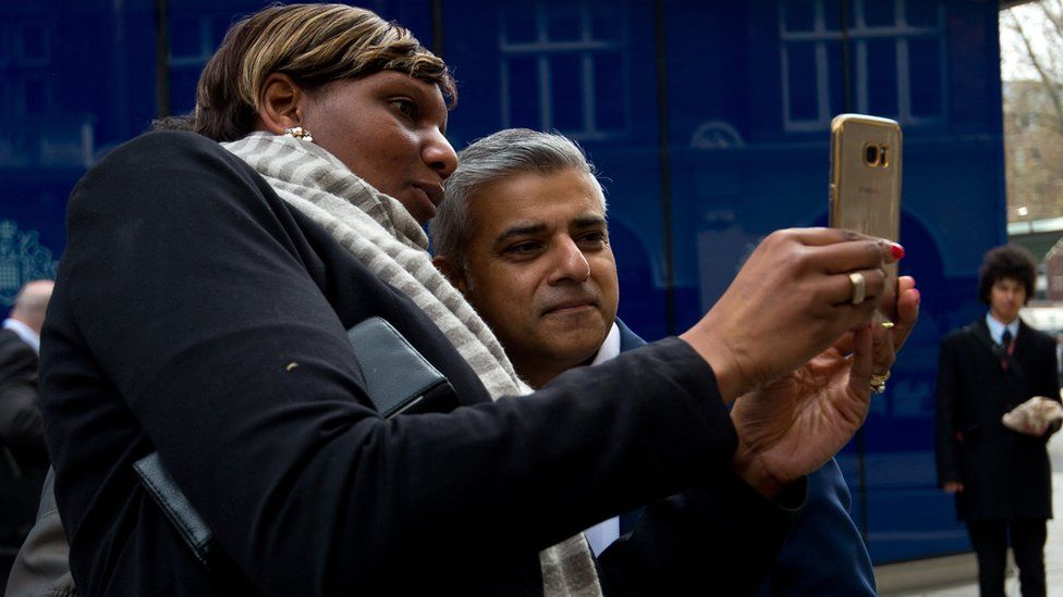 Sadiq Khan poses for a selfie on the campaign trail