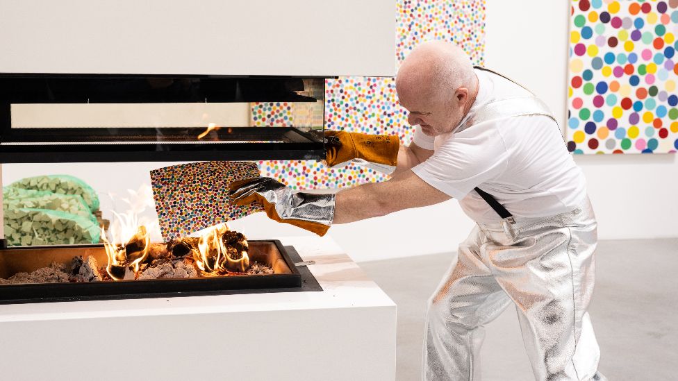 Damien Hirst burning his own artworks