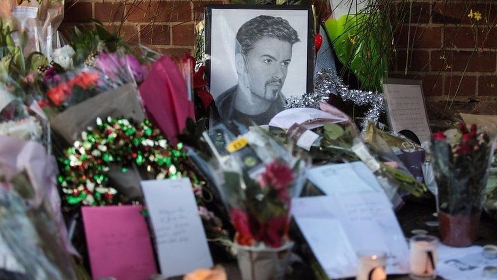 Fans and friends of George Michael have been leaving tributes outside his home in Highgate, North London.