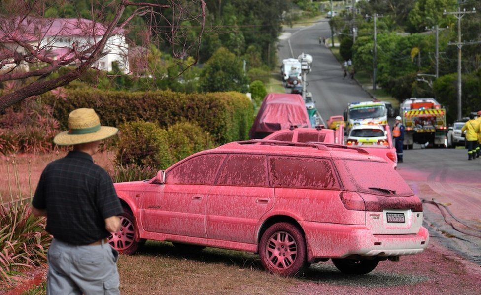 A car sprayed with fire retardant is seen after a bushfire in the residential area of Sydney on November 12, 2019