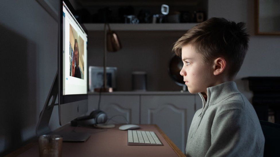 Boy being taught online at home