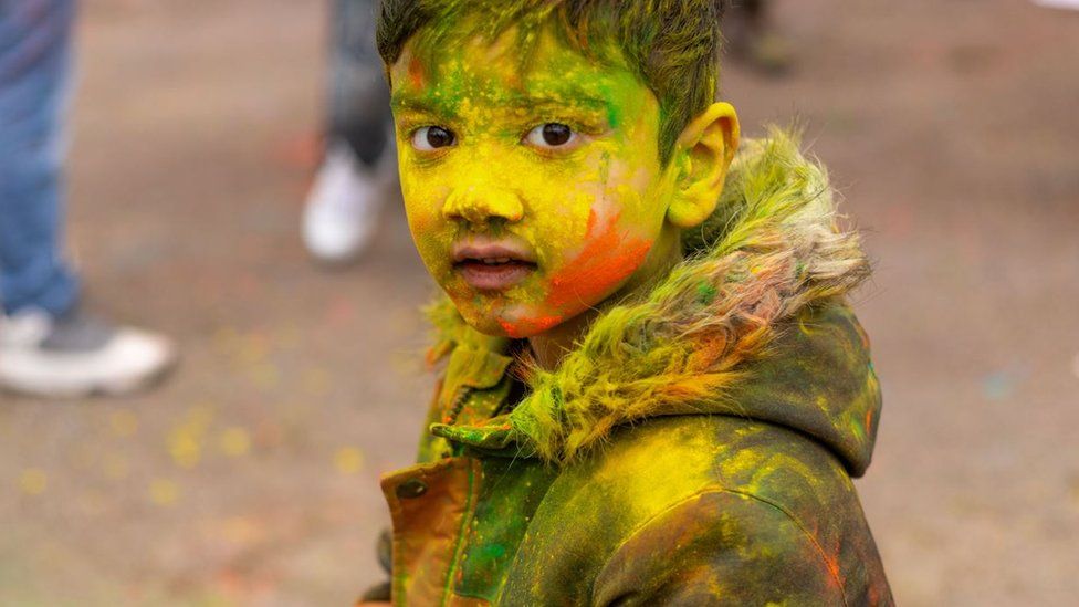 A boy at a Holi celebration