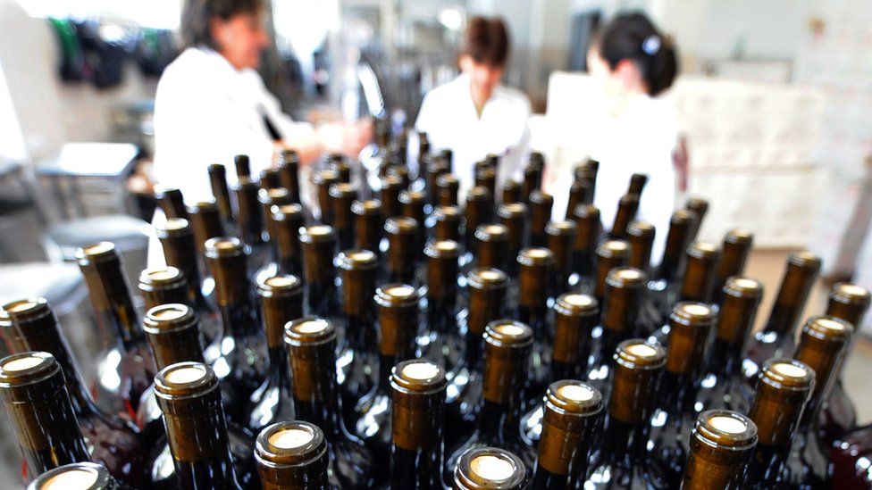 Bottles move along a conveyor belt towards the packing bay at a wine factory in Lilo near Tbilisi, on June 20, 2013.