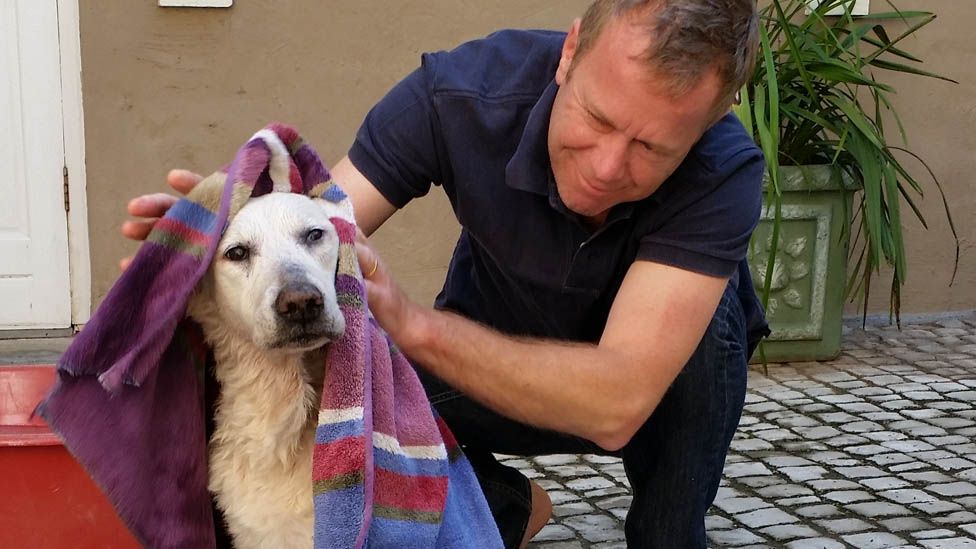 Andrew Harding with his dog, Lily