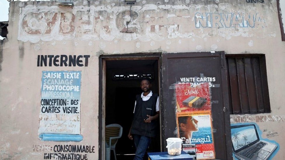Congolese internet cafe owner Theo stands at the entrance of his empty business in Kinshasa, Democratic Republic of Congo, January 7, 2019