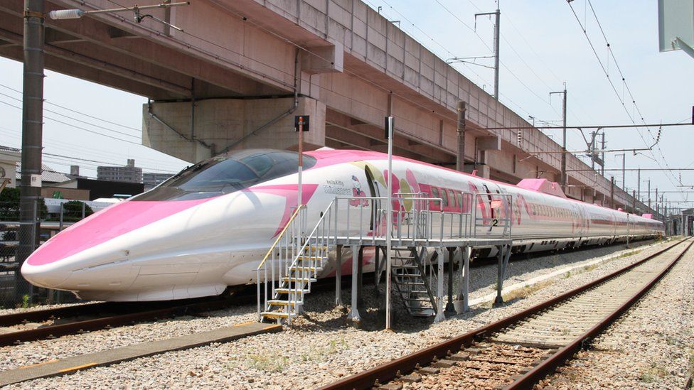 A Shinkansen train adorned with special livery bearing popular character Hello Kitty