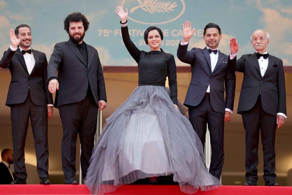 (From L) Iranian actor Navid Mohammadzadeh, Iranian film director Saeed Roustayi, Iranian actress Taraneh Alidoosti, Iranian-US actor Payman Maadi and Iranian actor Saeed Poursamimi arrive for the screening of the film "Leila's Brothers" during the 75th edition of the Cannes Film Festival in Cannes, southern France, on May 25, 2022.