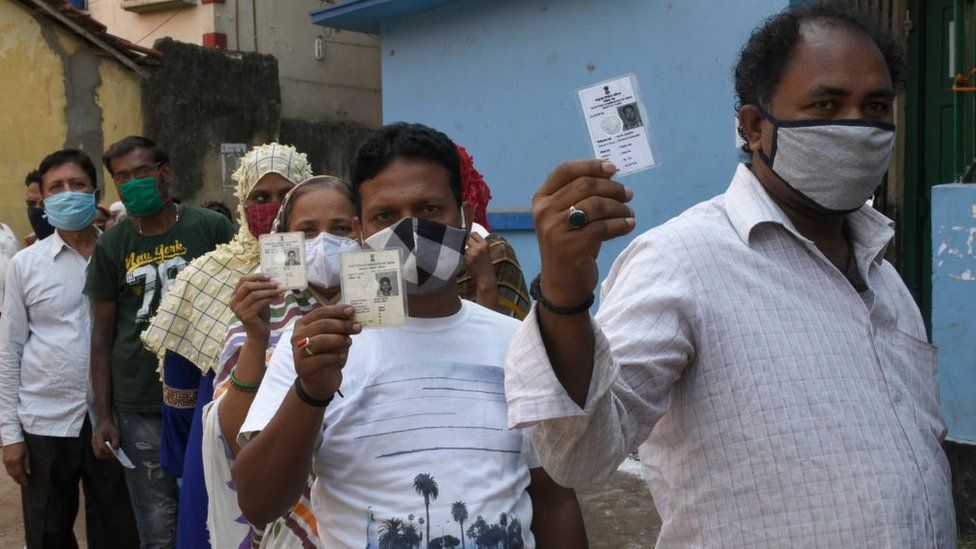 Voters showing their Voter Identity Cards before enter the Polling Booth at Kolkata