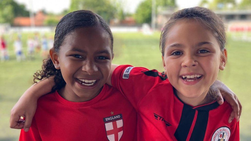 Two girl football fans