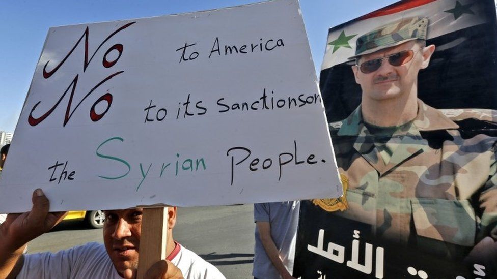 Supporters of President Bashar al-Assad protests against new US sanctions in Umayyad Square, Damascus (11 June 2020)