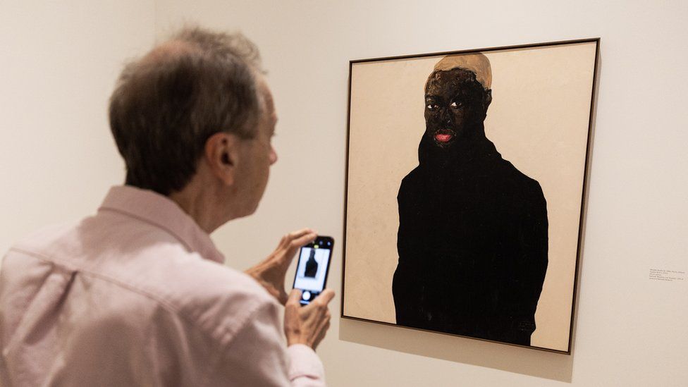 A guest looks at the painting by Ghanaian artist Amoako Boafo entitled "Hudson Burk 1" at the Hammer Museum in Los Angeles, California, the US - Friday 24 March 2023