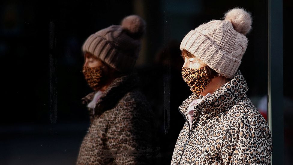 Woman wearing mask in St Albans, 4 January 2022