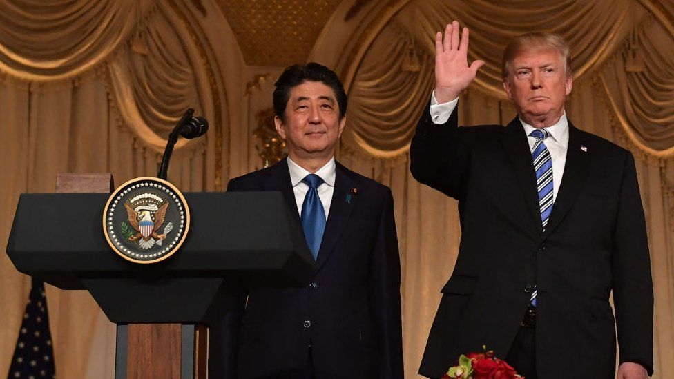Japan's Prime Minister Shinzo Abe stands with US President Donald Trump at the end of a joint press conference at Trump's Mar-a-Lago estate in Palm Beach, Florida on April 18, 2018.