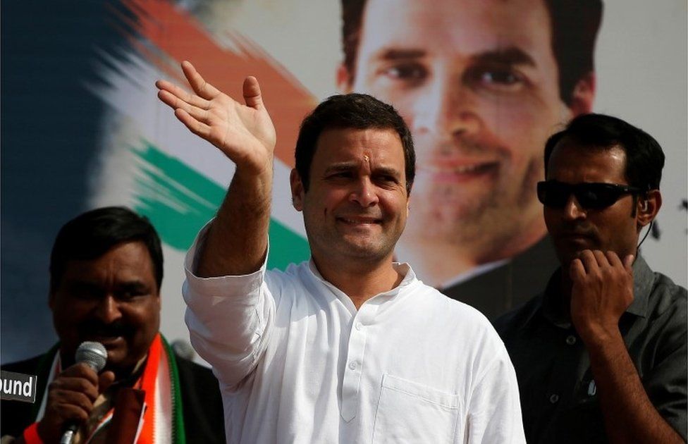 Rahul Gandhi of the main opposition Congress Party waves to his supporters during a rally ahead of Gujarat state assembly elections, at a village on the outskirts of Ahmedabad, India November 11, 2017