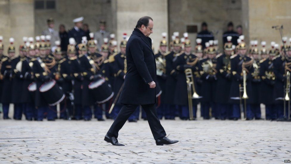 French President Francois Hollande attends a ceremony to pay a national homage to the victims of the Paris attacks at Les Invalides monument in Paris, France, 27