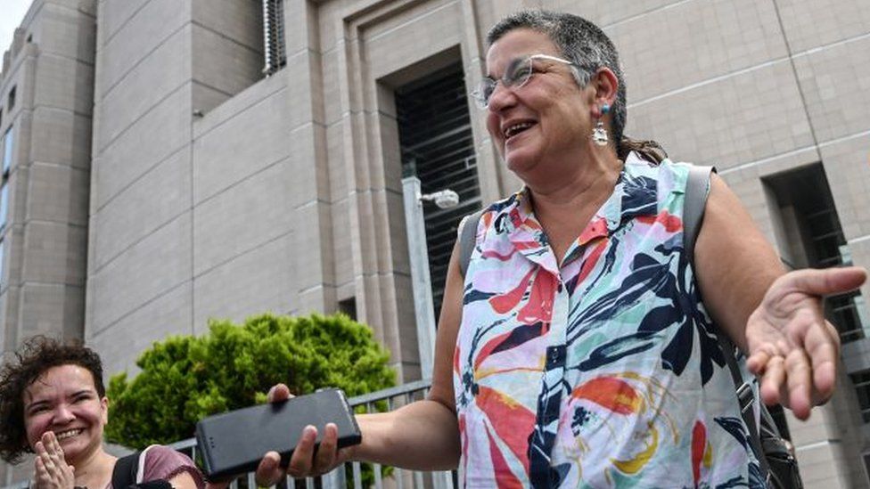 Human rights activist Sebnem Korur Fincanci gestures on July 17,2019 in front of Istanbul's courthouse after an Istanbul court acquitted her along with the Turkey representative for Reporters Without Borders (RSF) and another rights activists on charges of making "terror propaganda" for Kurdish militants