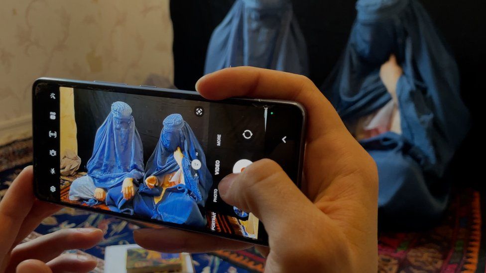 The sisters recording one of their latest songs on a mobile phone