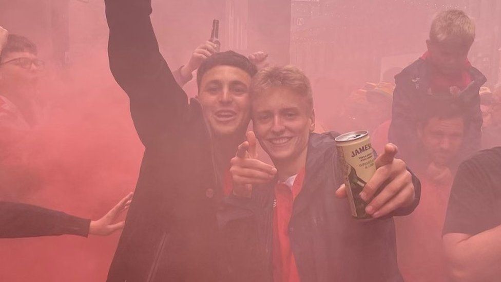 Rhys Thompson (right) with a friend at the game