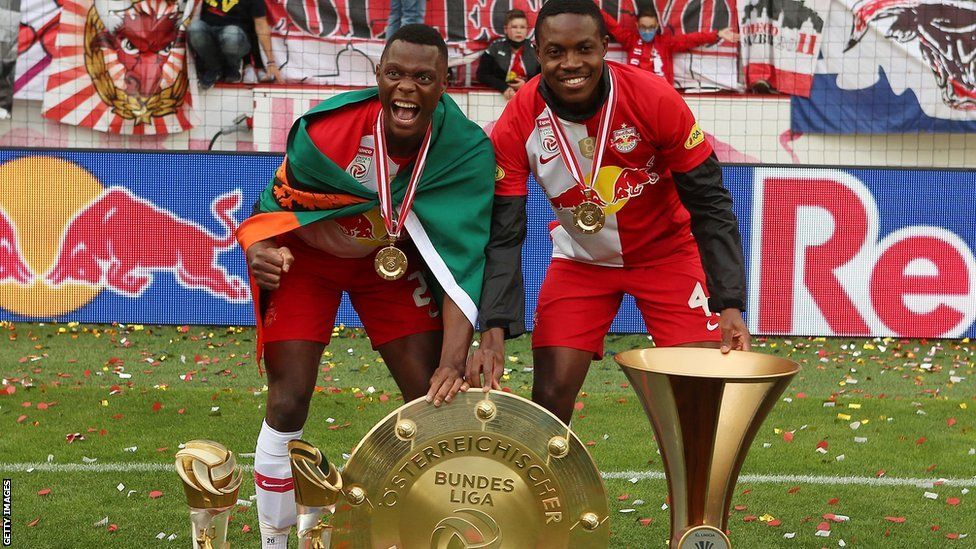 Zambia duo Patson Daka (left) and Enoch Mwepu celebrate with RB Salzburg's Austrian Bundesliga and FA Cup trophies