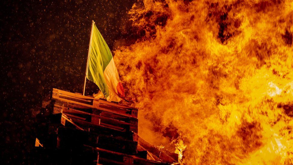 An Irish tricolour was placed on the Adam Street bonfire before it was lit