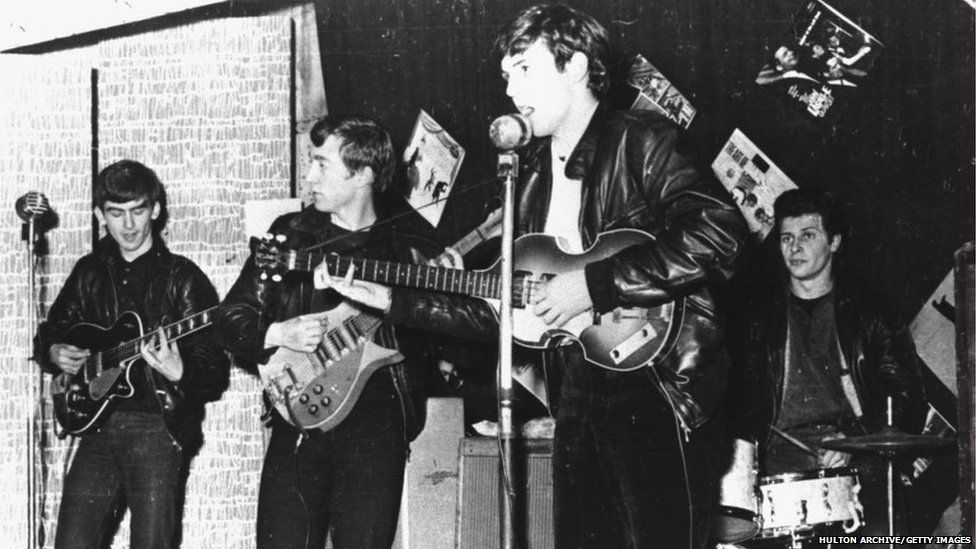 The Beatles - with original drummer Pete Best - perform in a Liverpool club prior to signing their first recording contract, Liverpool, England, 1962. L-R: George Harrison, John Lennon, Paul McCartney, and Pete Best