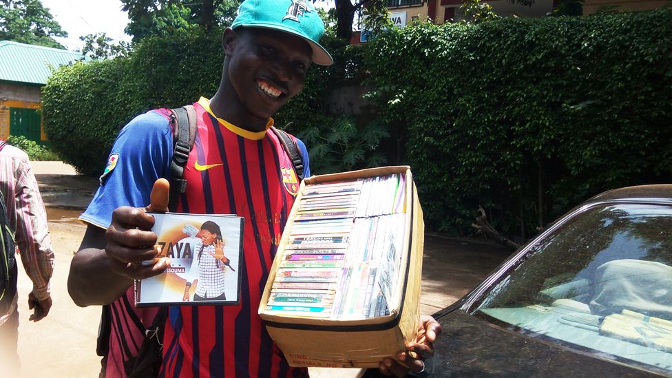 Mamadou Saliou Barry selling CDs in Conakry. Photo: Alhassan Sillah, BBC Africa